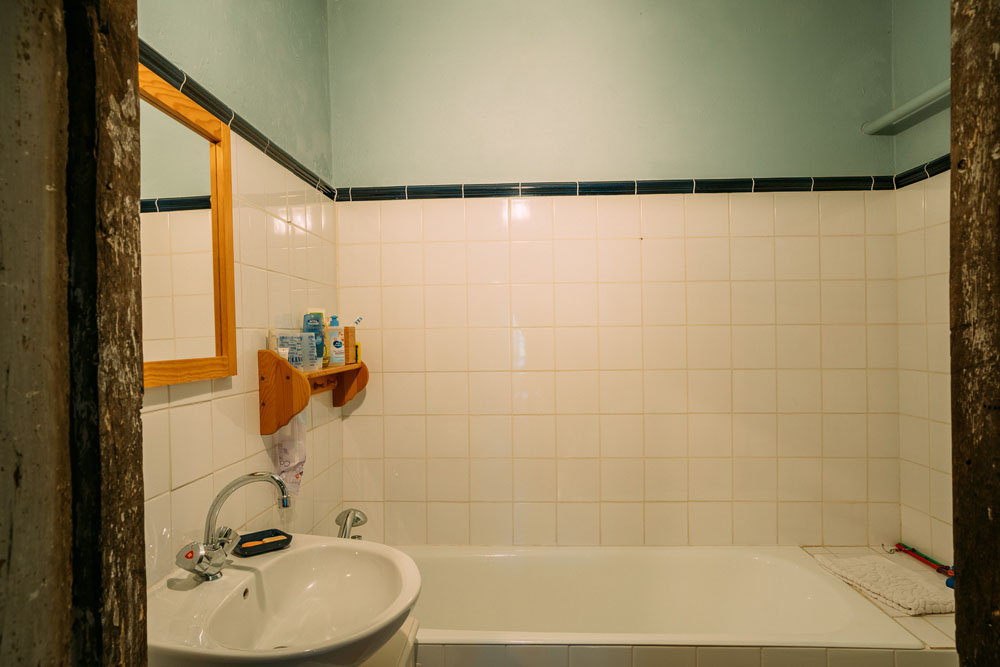 Bedroom 2 small en-suite bath, basin & WC. 