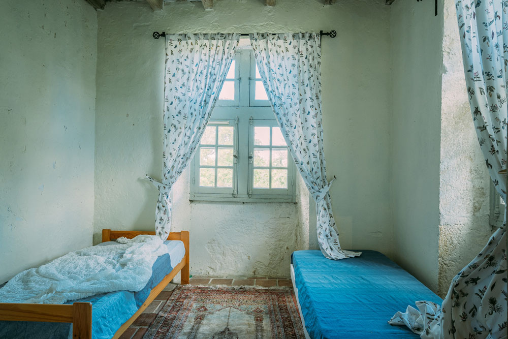Tower bedroom, 3.3x3.3m, an adjoining twin with mullioned windows.